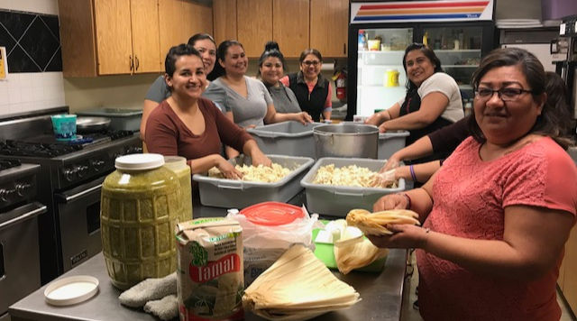 A group of women making tamales