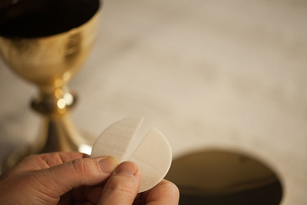 Hands holding a host during consecration