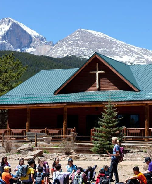 A group of kids playing gaga ball in the mountains