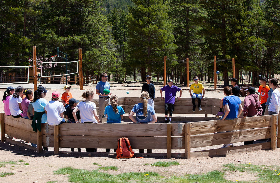 Children playing gaga ball in the mountains