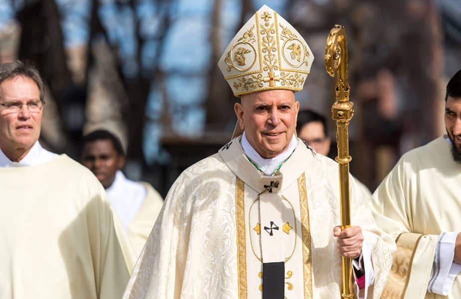 Archbisop Samuel Aquila walking with his crozier